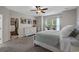 Spacious bedroom with walk-in closet, neutral walls, ceiling fan, and great natural light at 3620 Diamond Stars Way, Little River, SC 29566