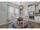 Dining area featuring ample natural light, a chandelier, and stainless steel appliances at 3620 Diamond Stars Way, Little River, SC 29566