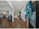 Inviting entryway with wood floors, open layout, decorative accents, and view into the living spaces at 3620 Diamond Stars Way, Little River, SC 29566