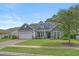Charming single-story home features a well-manicured lawn and inviting curb appeal with stone accents at 3620 Diamond Stars Way, Little River, SC 29566