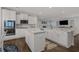 Modern kitchen with white cabinetry, granite countertops, and a large kitchen island for entertaining at 3620 Diamond Stars Way, Little River, SC 29566