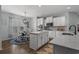 Kitchen with a granite island, stainless steel appliances, and a breakfast nook with abundant natural light at 3620 Diamond Stars Way, Little River, SC 29566
