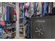 Spacious walk-in closet offering ample storage space with shelving for clothes and accessories and a cannon safe at 3620 Diamond Stars Way, Little River, SC 29566