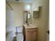 Bright bathroom features a vanity with storage and a standard toilet under a round light fixture at 3761 Citation Way # 531, Myrtle Beach, SC 29577