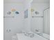Clean and well-maintained bathroom with a single sink and decorative fish decals at 404 1St Ave. N # H, North Myrtle Beach, SC 29582