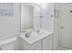 Clean bathroom featuring a white vanity, ample lighting, and a large mirror at 404 1St Ave. N # H, North Myrtle Beach, SC 29582