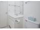 Bathroom featuring a white vanity with a sink and a toilet with a white tank at 404 1St Ave. N # H, North Myrtle Beach, SC 29582