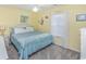 Bright, inviting bedroom with a comfortable queen-sized bed and ample natural light at 404 1St Ave. N # H, North Myrtle Beach, SC 29582