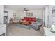 Inviting living room featuring wood flooring, and comfortable seating with half bathroom access at 404 1St Ave. N # H, North Myrtle Beach, SC 29582