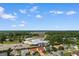 Aerial view of the community showcasing the address, lush greenery, and nearby buildings at 425 Mallard Lake Circle, Surfside Beach, SC 29575