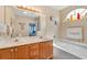 Bathroom with double sinks, a soaking tub and tile floors at 425 Mallard Lake Circle, Surfside Beach, SC 29575