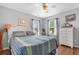 Comfortable bedroom with hardwood floors and two windows that let in natural light at 425 Mallard Lake Circle, Surfside Beach, SC 29575