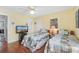 Bedroom featuring twin beds, ceiling fan, and flat screen television at 425 Mallard Lake Circle, Surfside Beach, SC 29575