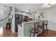 Eat-in kitchen featuring granite countertops, stainless steel appliances, and a breakfast bar at 425 Mallard Lake Circle, Surfside Beach, SC 29575