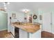 View of the kitchen featuring granite counters, stainless steel appliances, and hardwood floors at 425 Mallard Lake Circle, Surfside Beach, SC 29575
