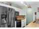 Modern kitchen with stainless steel appliances, white cabinets, and granite countertops at 425 Mallard Lake Circle, Surfside Beach, SC 29575