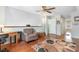 Living room with hardwood floors, ceiling fan, and neutral colored walls at 425 Mallard Lake Circle, Surfside Beach, SC 29575