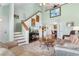 Bright living room featuring stairs, a staircase, and views into the dining area at 425 Mallard Lake Circle, Surfside Beach, SC 29575