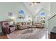 Cozy living room featuring hardwood floors, comfortable seating, and large windows at 425 Mallard Lake Circle, Surfside Beach, SC 29575
