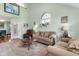 Bright living room featuring hardwood floors, comfortable seating, and natural light at 425 Mallard Lake Circle, Surfside Beach, SC 29575