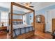 Spacious main bedroom with a four poster bamboo bed and matching furniture at 425 Mallard Lake Circle, Surfside Beach, SC 29575