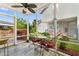 Screened porch with outdoor seating, a ceiling fan, and a view of the backyard at 425 Mallard Lake Circle, Surfside Beach, SC 29575