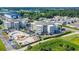Aerial view of resort buildings, a pool, and the surrounding neighborhood at 4350 Intercoastal Dr. # 2402, Little River, SC 29566