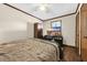 Bedroom with a cozy bed, ceiling fan, and view of the beach on the television at 4350 Intercoastal Dr. # 2402, Little River, SC 29566