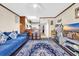 Bright living room with a ceiling fan, hardwood floors, a stylish area rug, and neutral paint at 4350 Intercoastal Dr. # 2402, Little River, SC 29566