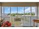 This covered porch features a nice view and provides plenty of space to sit and enjoy the outdoors at 4350 Intercoastal Dr. # 2402, Little River, SC 29566