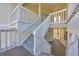 Exterior staircase featuring white wood rails and steps with building facade at 4350 Intercoastal Dr. # 2402, Little River, SC 29566