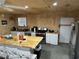 Full kitchen boasts stainless appliances, an eat-in island, and plenty of cabinet space at 445 W Willow Pond Rd., Johnsonville, SC 29555