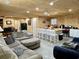 Open-concept living area with a central island, comfortable seating, and modern appliances at 445 W Willow Pond Rd., Johnsonville, SC 29555