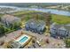 Aerial view of the condo building, pool, and nearby marina at 4450 Turtle Ln. # 2-A, Little River, SC 29566