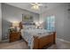 A cozy bedroom showcasing a wooden bed frame with decorative pillows and bedside tables with lamps at 4450 Turtle Ln. # 2-A, Little River, SC 29566