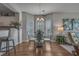 Dining area featuring a modern table, chairs, chandelier, and hardwood floors at 4450 Turtle Ln. # 2-A, Little River, SC 29566