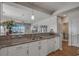 Kitchen with granite countertops, stainless steel sink and view to living area at 4450 Turtle Ln. # 2-A, Little River, SC 29566