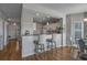 Open kitchen featuring granite countertops, breakfast bar, and modern appliances at 4450 Turtle Ln. # 2-A, Little River, SC 29566