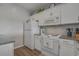 A bright kitchen featuring white cabinets, granite countertops, and modern appliances at 4450 Turtle Ln. # 2-A, Little River, SC 29566