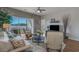 Cozy living room featuring water views, comfortable seating, and access to a patio at 4450 Turtle Ln. # 2-A, Little River, SC 29566