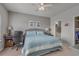 Bedroom with a calm color palette, ensuite bathroom, and a large window for natural light at 4450 Turtle Ln. # 2-A, Little River, SC 29566