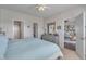 Well-lit bedroom with an ensuite bathroom, closet and view to the living area at 4450 Turtle Ln. # 2-A, Little River, SC 29566