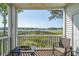 Screened porch with seating and a view of the marsh and waterway at 4450 Turtle Ln. # 2-A, Little River, SC 29566
