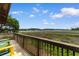 Scenic marsh view from the outdoor balcony with adirondack chairs at 4520 Coquina Harbour Dr. # F-3, Little River, SC 29566