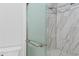 Modern bathroom featuring glass shower door and tiled walls at 4520 Coquina Harbour Dr. # F-3, Little River, SC 29566