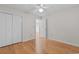 Bedroom features hardwood floors, a ceiling fan, and a double closet at 4520 Coquina Harbour Dr. # F-3, Little River, SC 29566