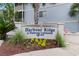 Harbour Ridge sign with flowerbeds and shrubbery located in a waterway community at 4520 Coquina Harbour Dr. # F-3, Little River, SC 29566