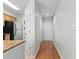 Bright hallway view leading to the entrance with a kitchen area and appliances to the left at 4520 Coquina Harbour Dr. # F-3, Little River, SC 29566