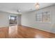Bright living room with wood flooring and sliding door to the outdoor patio at 4520 Coquina Harbour Dr. # F-3, Little River, SC 29566