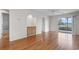 Spacious living area with wood floors leading to bathroom and outdoor space at 4520 Coquina Harbour Dr. # F-3, Little River, SC 29566